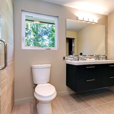 New simple modern bathroom with double sinks and natural  color ceramic tile.